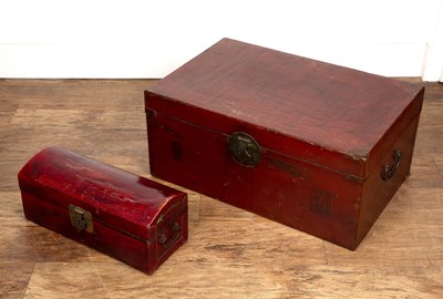 Lot 26 - Red lacquer pillow box and a similar trunk...