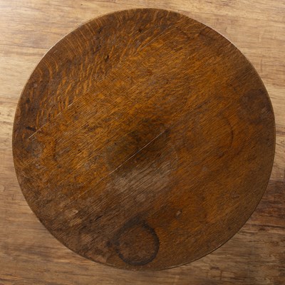 Lot 53 - In the manner of Heals oak, circular topped...