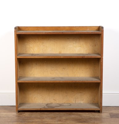 Lot 54 - Cotswold School pine open bookcase, with...