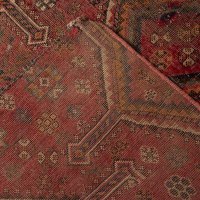 Lot 44 - Red ground rug fragment of geometric design,...