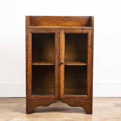Lot 108 - Attributed to Heals oak cupboard, with...
