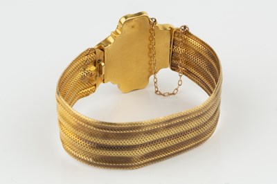 Lot 31 - A yellow precious metal bracelet, of woven...