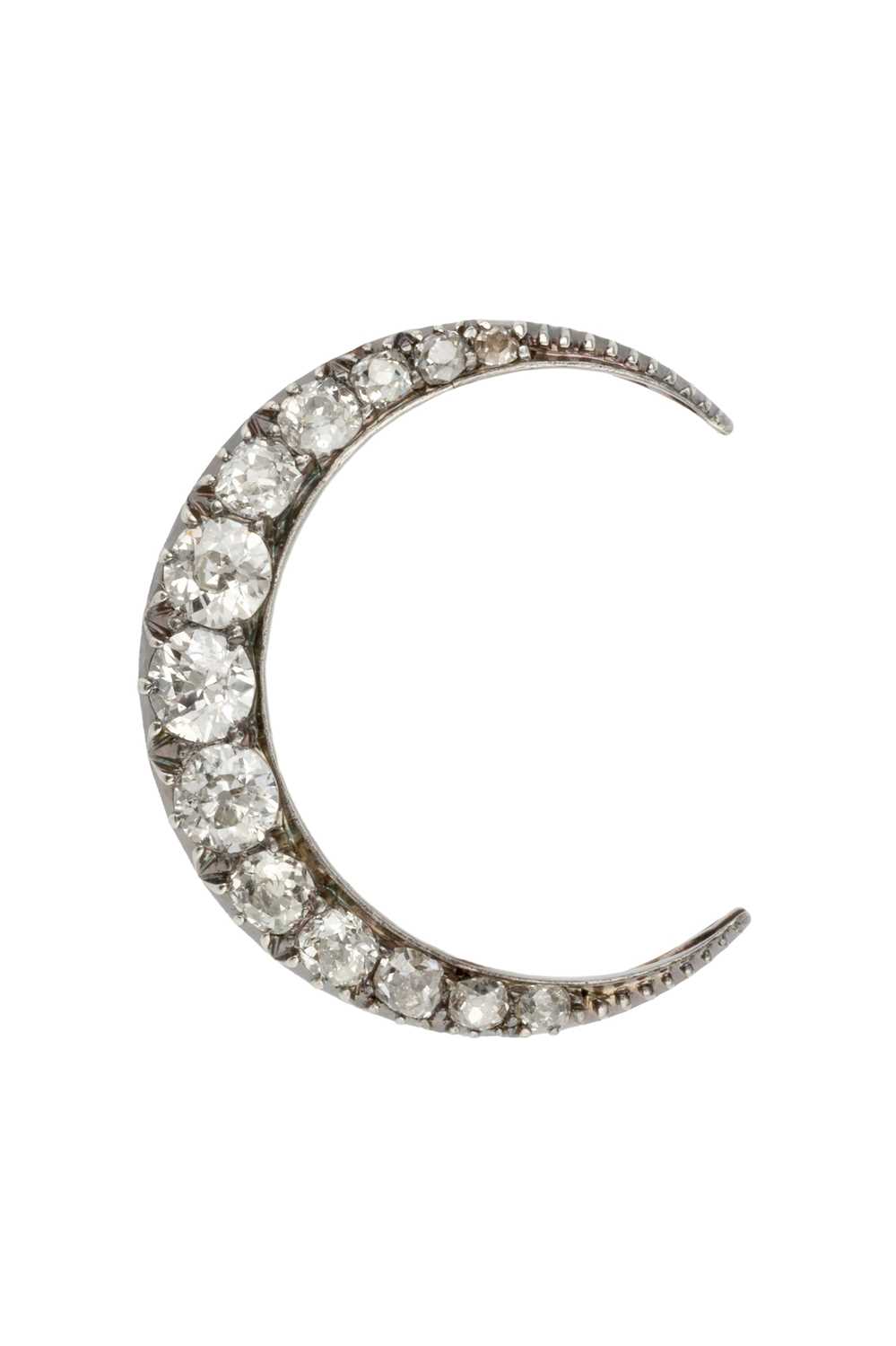 Lot 35 - A diamond crescent brooch, set with thirteen...