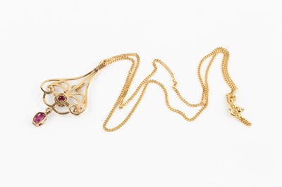 Lot 38 - A 9ct gold, ruby and seed pearl pendant, of...