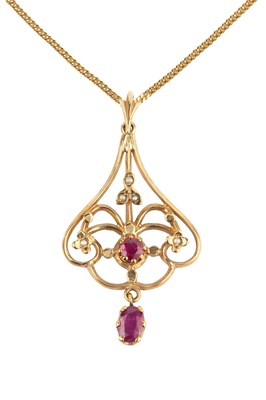Lot 38 - A 9ct gold, ruby and seed pearl pendant, of...