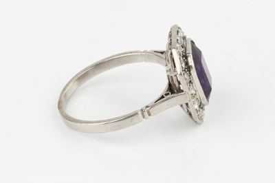 Lot 33 - An amethyst and diamond cluster ring, the...