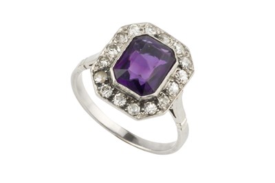 Lot 33 - An amethyst and diamond cluster ring, the...