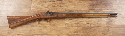 Lot 295 - Flintlock rifle with a walnut stock, engraved...