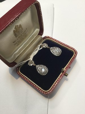 Lot 16 - A pair of diamond ear pendants, each designed...