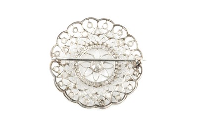 Lot 19 - A diamond panel brooch, the circular openwork...