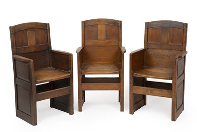 Lot 783 - Arts & Crafts Three oak armchairs, 1934...