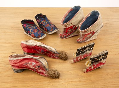 Lot 275 - Four pairs of embroidered shoes Chinese set in...