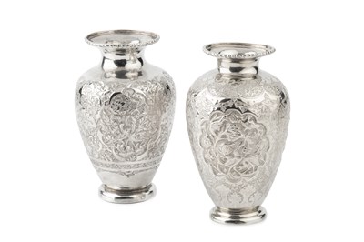 Lot 795 - An Indian silver baluster vase, engraved and...