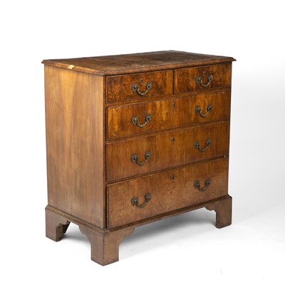 Lot 31 - A George II walnut chest of two short and...