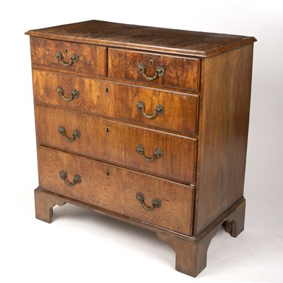 Lot 31 - A George II walnut chest of two short and...