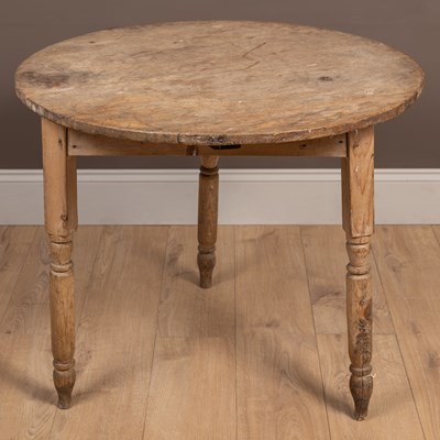 Lot 1084 - An antique pine cricket table