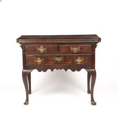 Lot 157 - An unusual 18th century oak side table  with a...