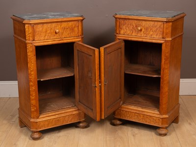 Lot 214 - A pair of Continental marble-topped burr maple bedside cabinets