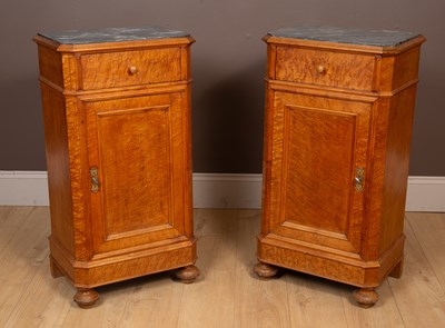 Lot 214 - A pair of Continental marble-topped burr maple bedside cabinets