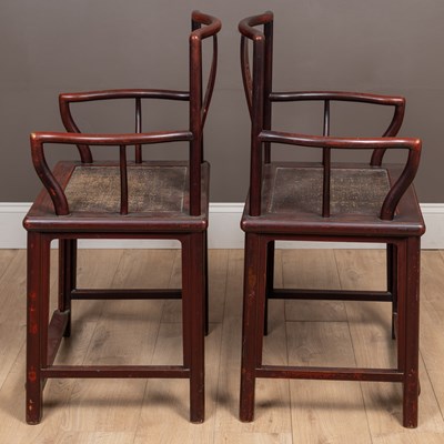 Lot 54 - A pair of Chinese red lacquered elbow chairs