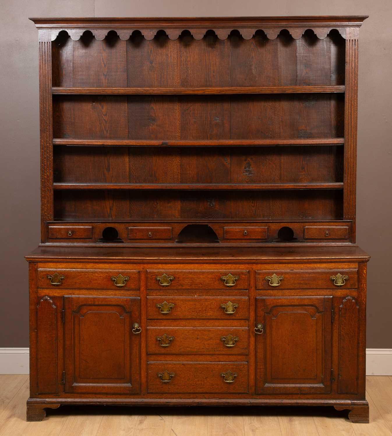 Lot 1129 - A George III oak dressser