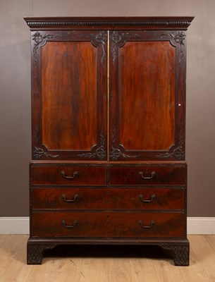 Lot 312 - A mahogany Chippendale style linen press