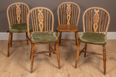 Lot 177 - A set of four wheel-back kitchen chairs