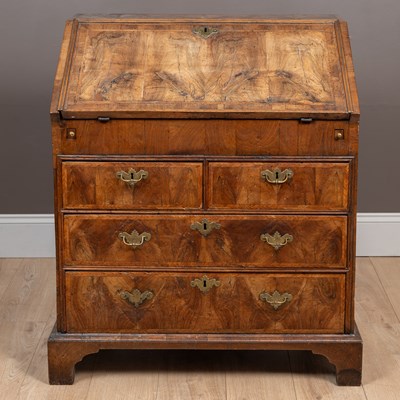 Lot 142 - An early 18th century walnut bureau