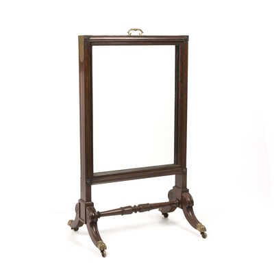 Lot 197 - A Georgian mahogany fire screen with sliding...