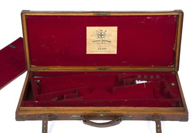 Lot 205 - An early 20th century leather bound oak gun...