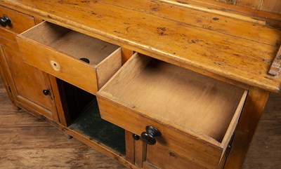 Lot 88 - Pine kitchen dresser in two parts, fitted with...
