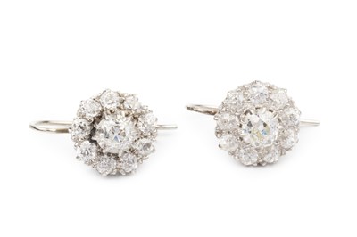 Lot 100 - A pair of diamond cluster earrings, the...