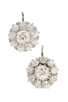 Lot 100 - A pair of diamond cluster earrings, the...