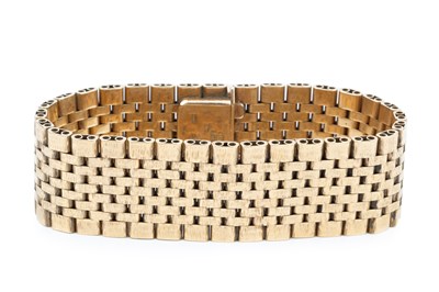 Lot 104 - A 9ct gold flexible link strap bracelet, with...