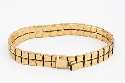 Lot 106 - An 18ct gold bracelet, composed of two rows of...