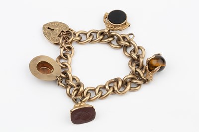 Lot 110 - A 9ct gold curb link charm bracelet, with...