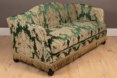 Lot 140 - A camel back sofa