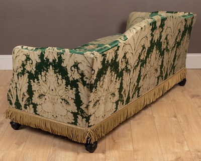 Lot 140 - A camel back sofa