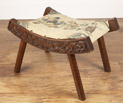 Lot 13 - Celtic style carved wooden stool In the manner...