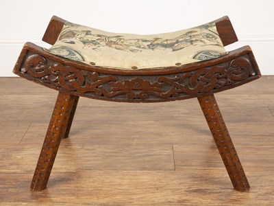Lot 13 - Celtic style carved wooden stool In the manner...