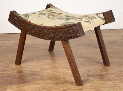 Lot 13 - Celtic style carved wooden stool In the manner...