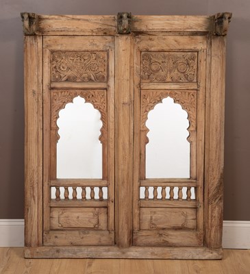 Lot 282 - A pair of 19th century Indian carved wood shutters