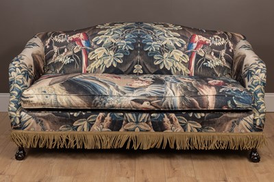 Lot 250 - A sofa with verdure tapestry style upholstery