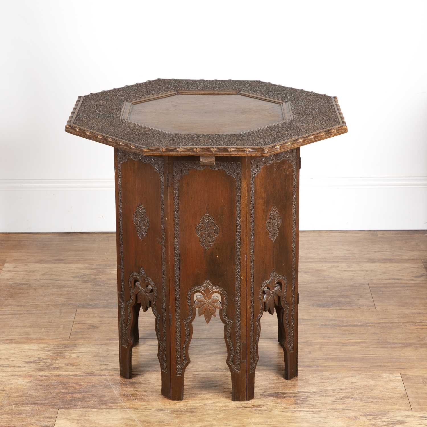 Lot 35 - Octagonal carved table Indian, the top with an...