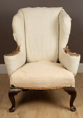 Lot 345 - A Howard & Sons maple framed wingback armchair