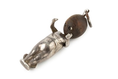 Lot 595 - A WWI silver 'Fumsup' mascot doll, with 'touch...