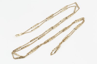 Lot 136 - A yellow metal fancy long chain, with pierced...