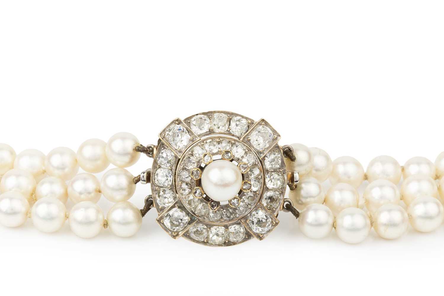 Lot 140 - A cultured pearl three strand necklace with...