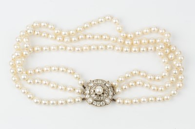 Lot 140 - A cultured pearl three strand necklace with...