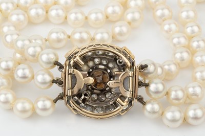 Lot 140 - A cultured pearl three strand necklace with...